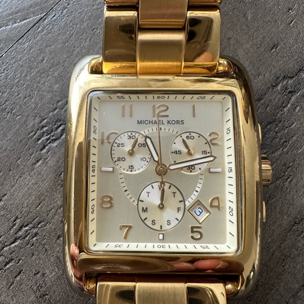 Chunky man’s style gold tone mk watch
